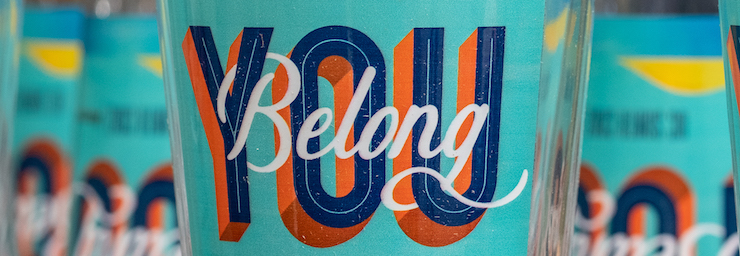 Image of UCSC Alumni pint glass that reads, "you belong"